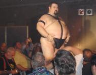 After stripping down to my leather harness and jockstrap, I bounced my belly to cheers from the audience!